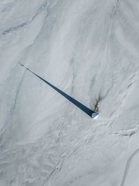 Low section of person skiing on snow