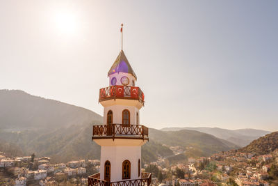 Tower amidst buildings against sky