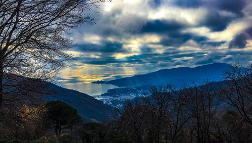 Scenic view of snowcapped mountains against sky during sunset