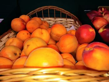 Close-up of apples in basket for sale at market
