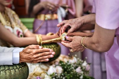 People performing traditional cultures during wedding ceremony