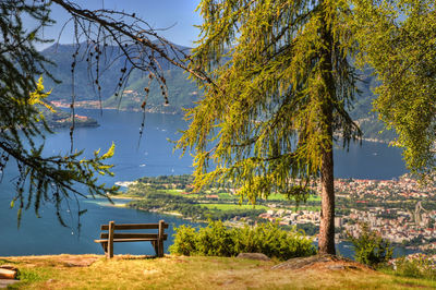 Gazebo by lake against sky