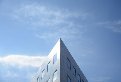 Low angle view of building against blue sky