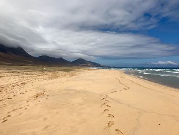 Scenic view of beach against sky