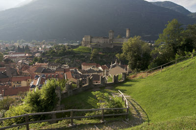 High angle view of townscape by trees in city