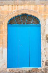 Closed blue door of building