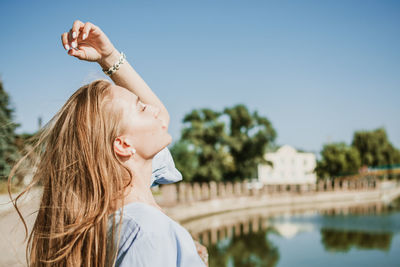 Portrait of woman against sky