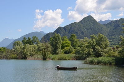 Scenic view of lago d'idro and mountains against sky