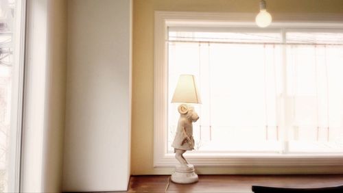 Boy looking through window