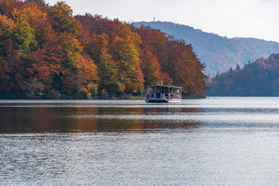 Tourist boat on lake at plitvice lakes national park in croatia in autumn