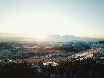 Aerial view of landscape against sky during sunset