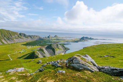 High angle view of townscape by sea against sky