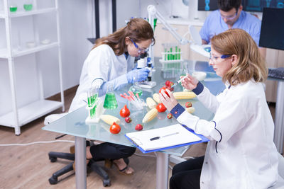 Female doctor examining chemical