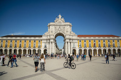 People in front of historic building