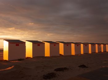 Scenic view of beach against sky during sunset