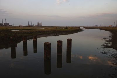 Scenic view of lake against sky at sunset