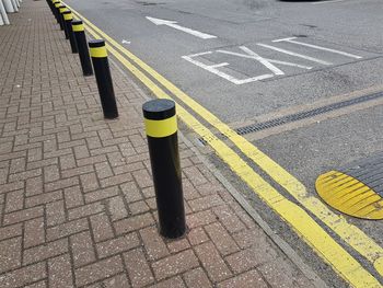 High angle view of bollards by street