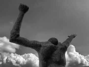 Low angle view of statue against sky