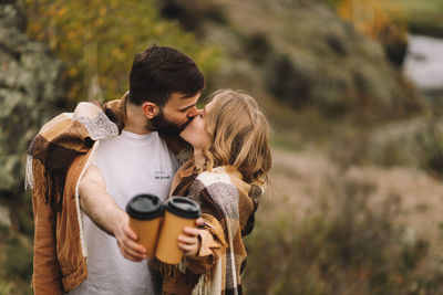 Young couple kissing outdoors