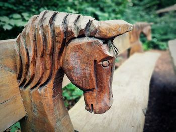 Close-up of rusty metal on wood