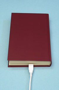 Close-up of red open book on table