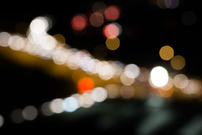 Defocused image of illuminated lights at night