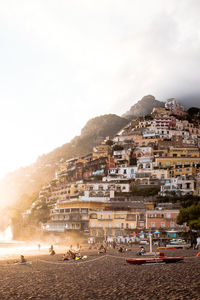 Town by sea against sky in city