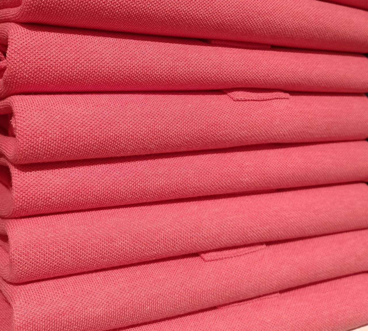 FULL FRAME SHOT OF PINK STACK OF BLUE FABRIC
