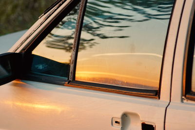 Reflection of car on side-view mirror