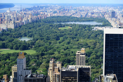 High angle view of buildings and trees against sky