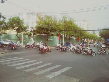 Bicycles on street against clear sky