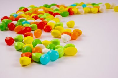 Close-up of colorful candies against white background