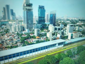 High angle view of buildings in city against sky