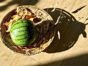 High angle view of fruits in basket on table