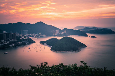 Scenic view of sea against orange sky