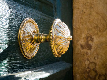 Close-up of door knocker on wall