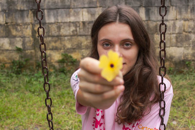 Young woman holding swing