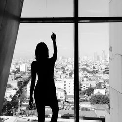 Woman looking at cityscape