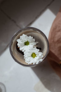 White flowers and coffee close up