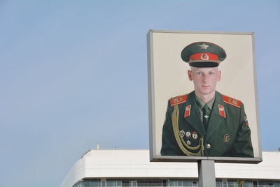 Portrait of mature man against blue sky