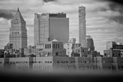 Modern buildings in city against sky