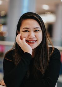 Portrait of smiling young woman