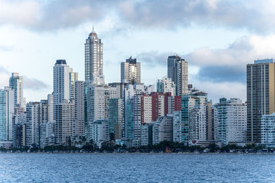 Modern buildings in city against sky