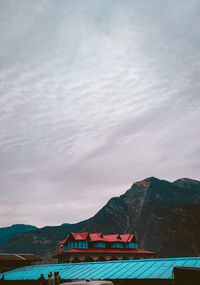 Scenic view of building against cloudy sky