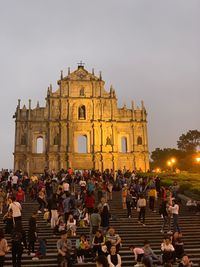 Group of people in front of historical building