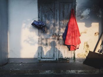 Red flags hanging on house window