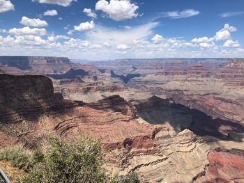 Scenic view of dramatic landscape against cloudy sky