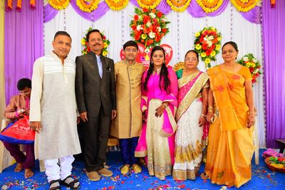 Portrait of family with bride and groom posing during wedding ceremony 