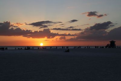 Scenic view of beach against sky during sunset