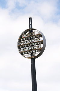 Low angle view of communications tower against sky